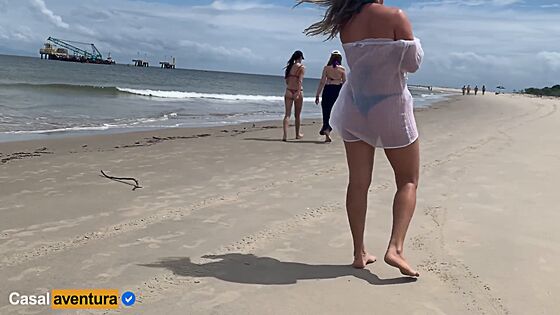 people walking near handjob at beach xv hub